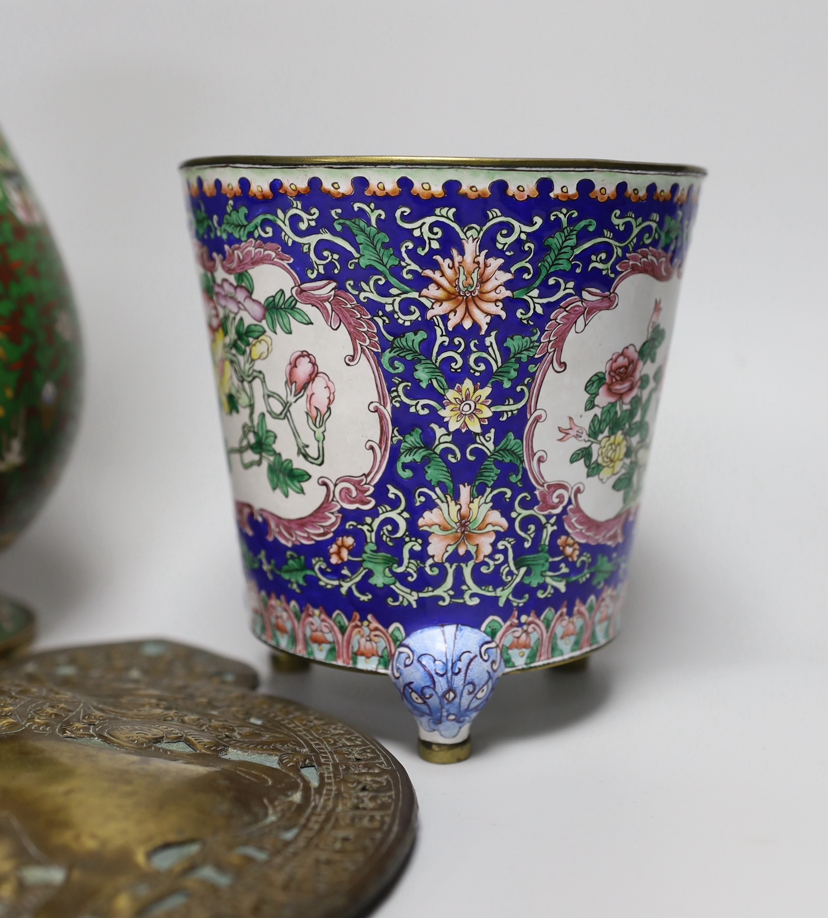 A Chinese Guangzhou enamel vase, a cloisonné enamel vase and an Indonesian brass panel, tallest 26cm high